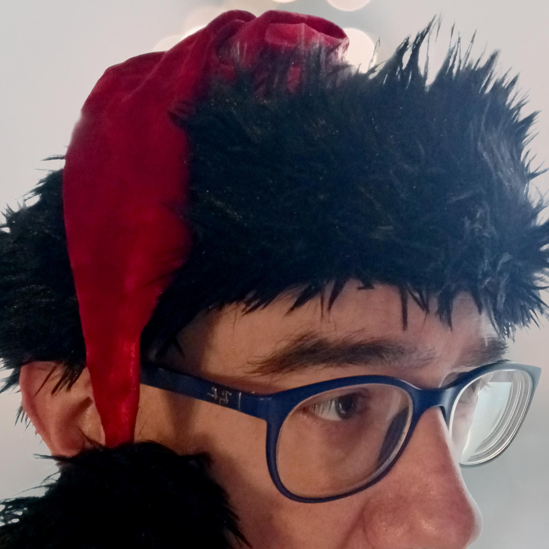 Andy Erickson wearing a red hat from Dapper & Jolly